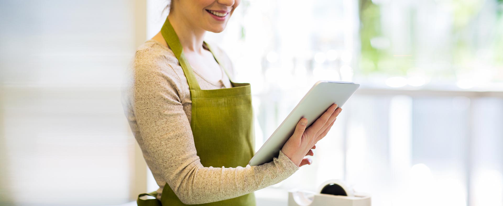 Florist holding tablet