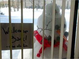 snowman outside of desk window