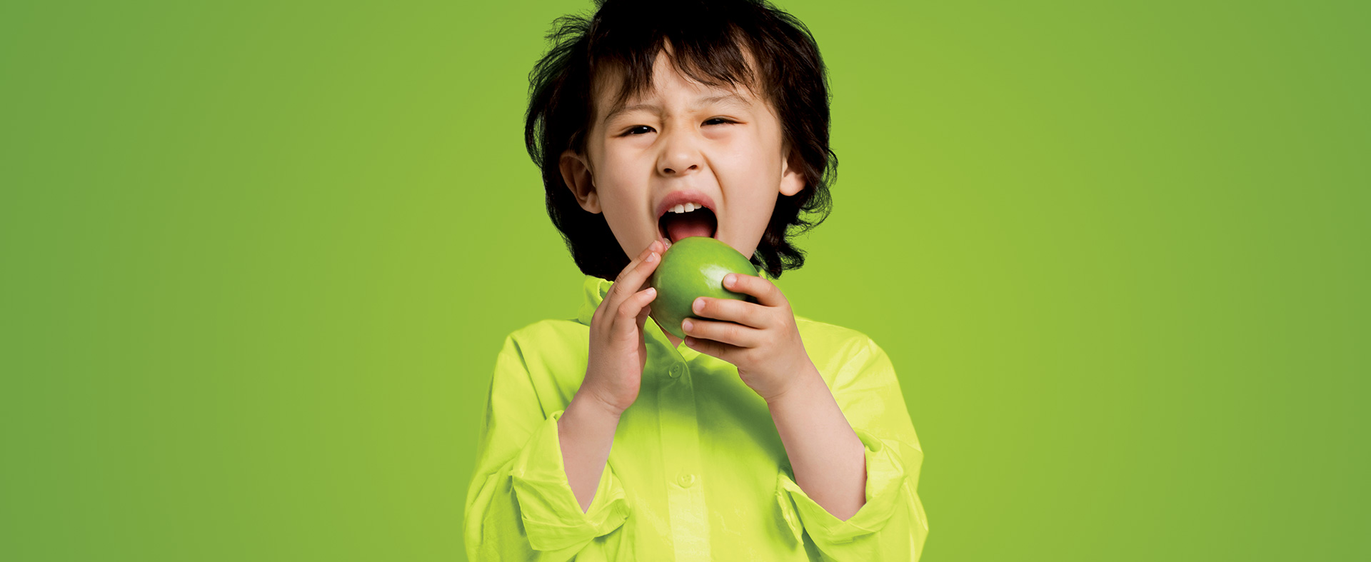 Young Boy with Green Apple